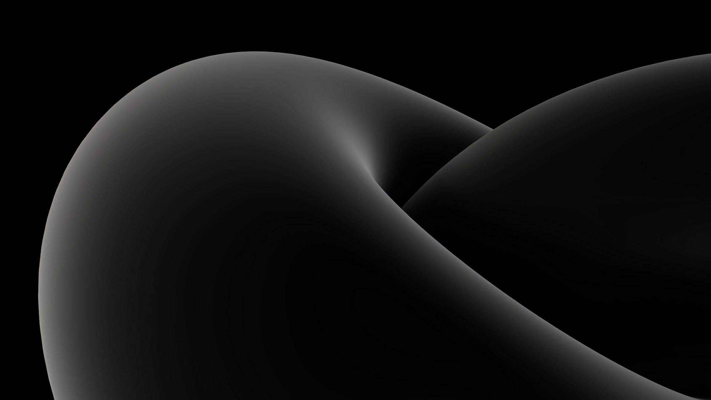 Forme abstraite grise aux courbes douces sur fond noir